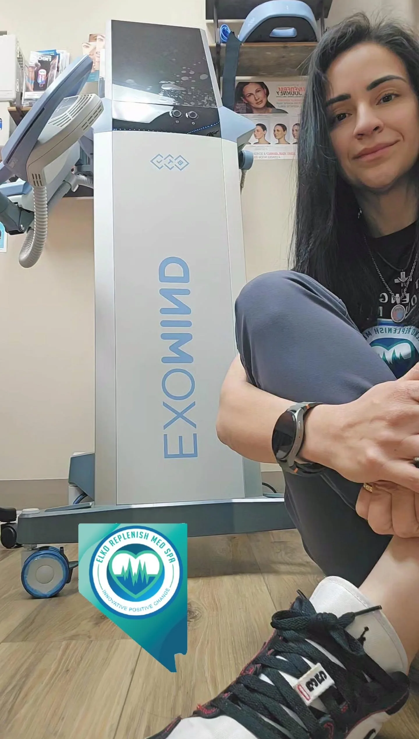 Woman sitting near EXOWIND therapy machine at Elko Replenish Med Spa