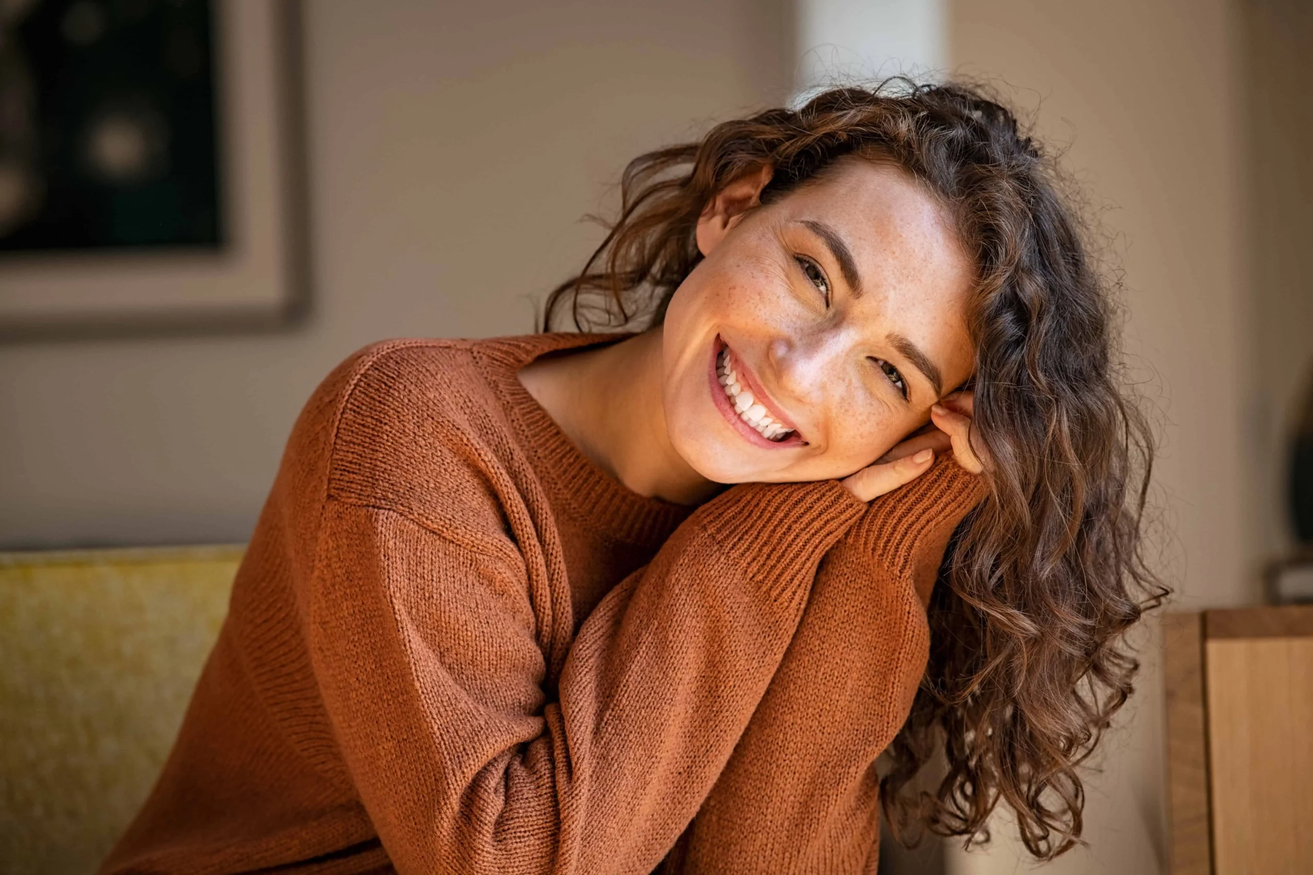 Happy woman after receiving EXOMIND non-invasive mental health treatment at Elko Replenish Med Spa.