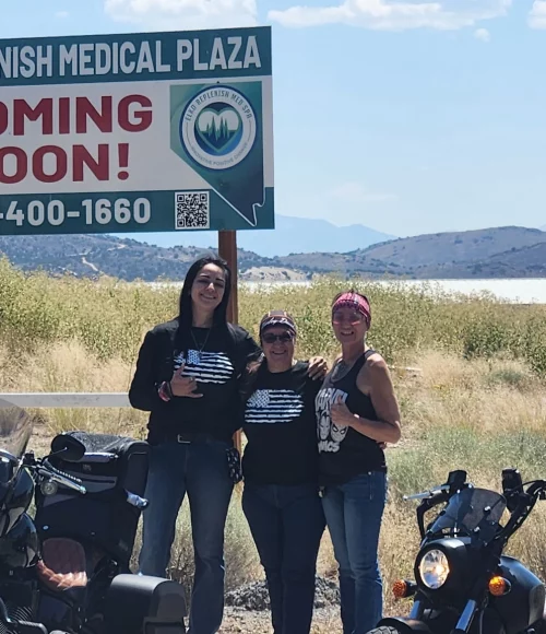 Elko Replenish Med Spa team by “Coming Soon” sign
